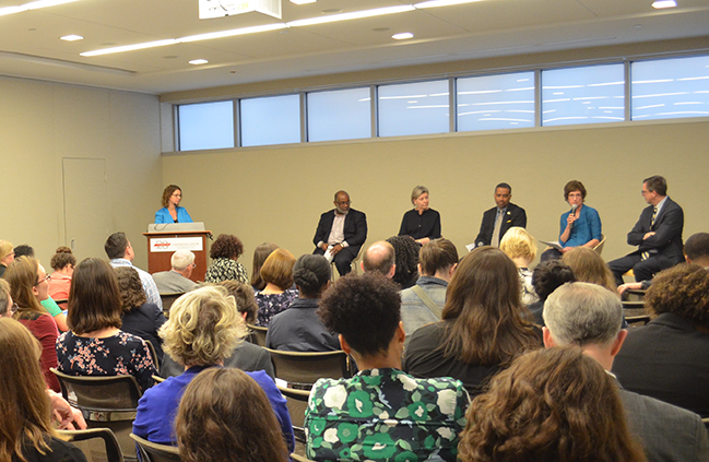 Attendees listen in to the panel discussion